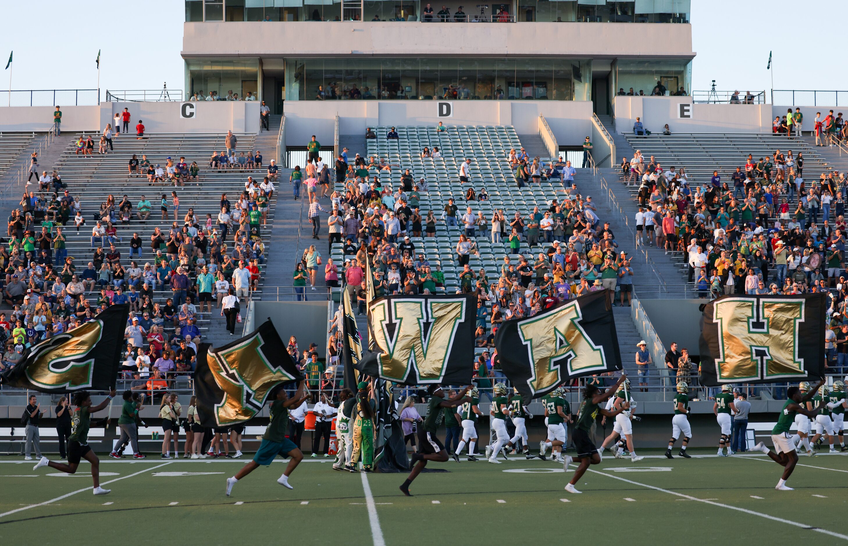 The Birdville Hawks enter the field before a game against Mansfield Timberview at the...