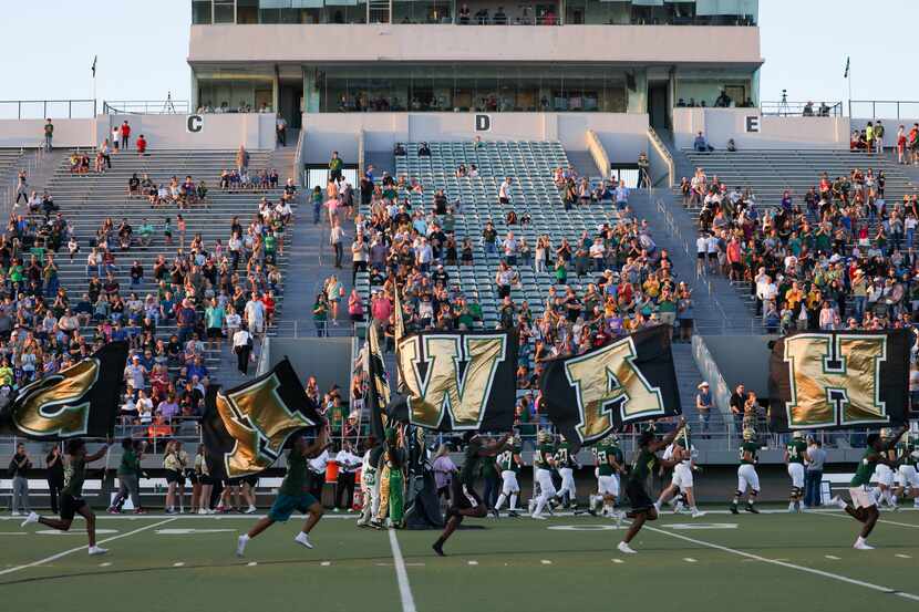 The Birdville Hawks enter the field before a game against Mansfield Timberview at the...