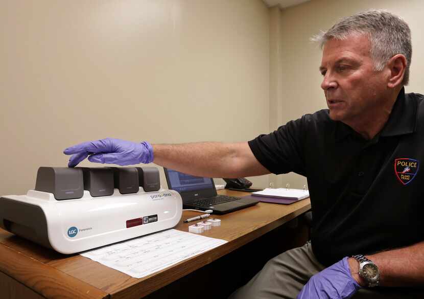 CSI and property/evidence unit manager Rick Staub runs a sample through the ParaDNA System...