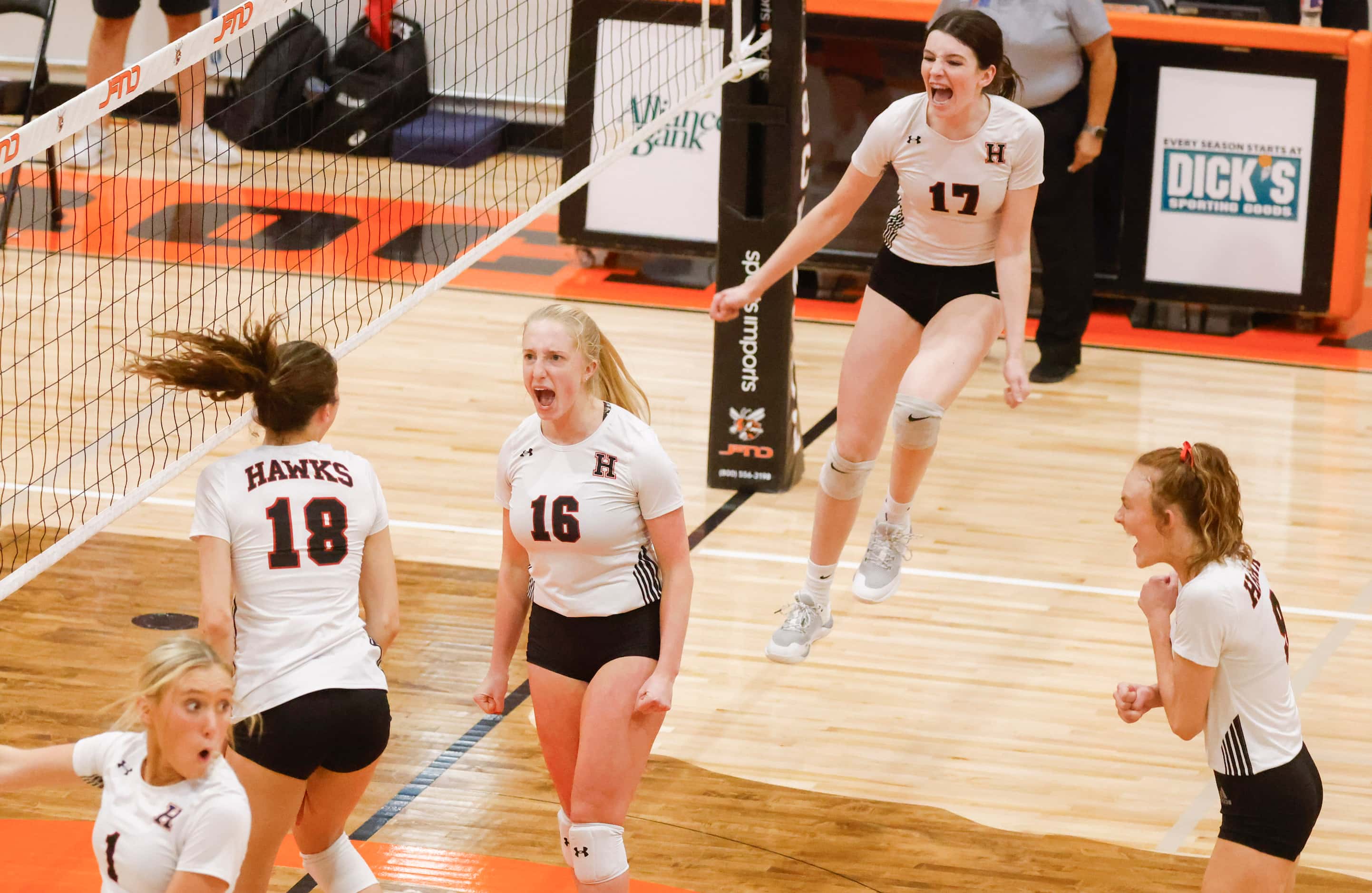 Rockwall Heath’s Abby Lemp (18), Logan Younger (16) and gave McHenry (17) cheer after a...