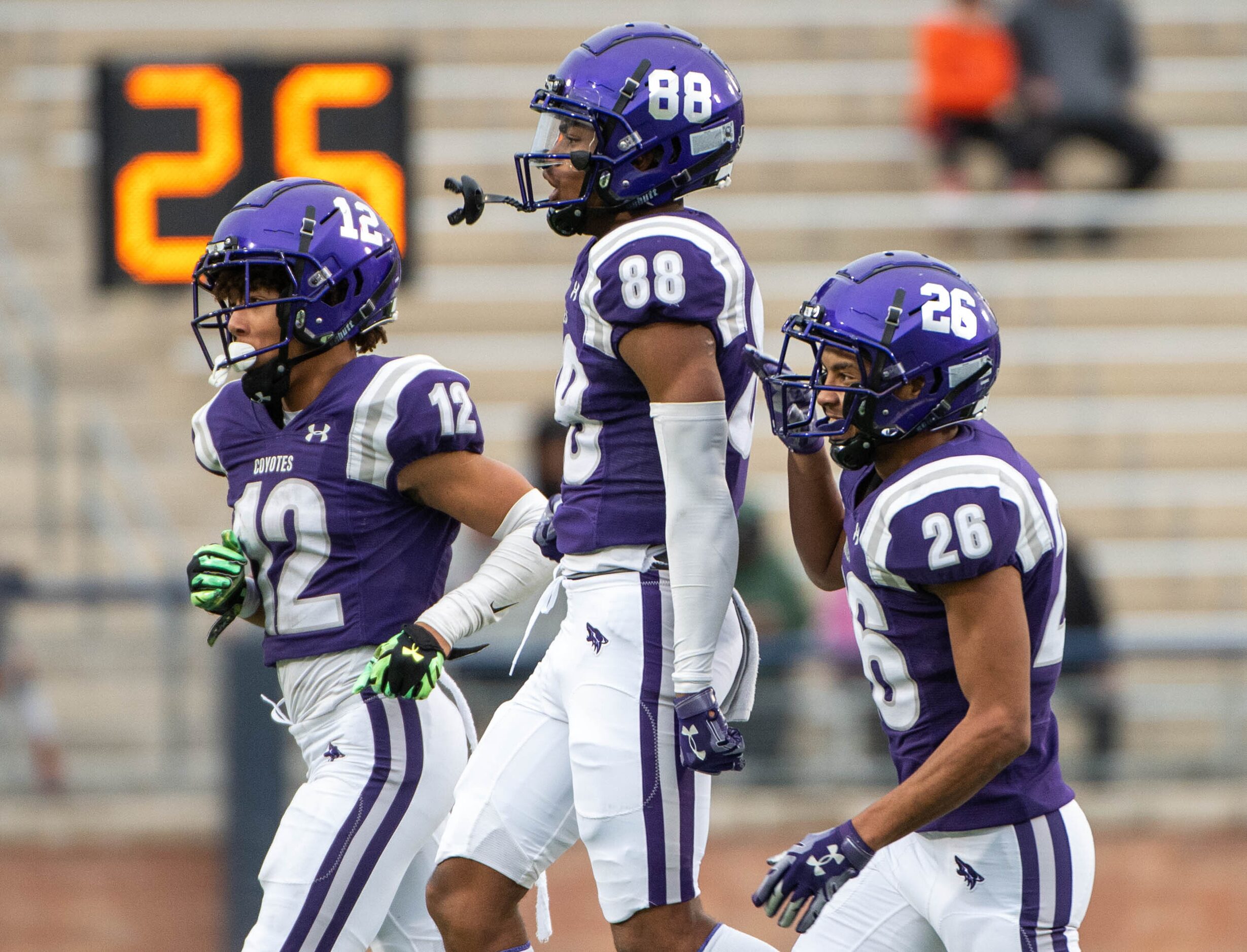 Anna’s  Jonathan Brown (88) celebrates with Elijah Robertson (12) and  Zhavier Bennett (26)...