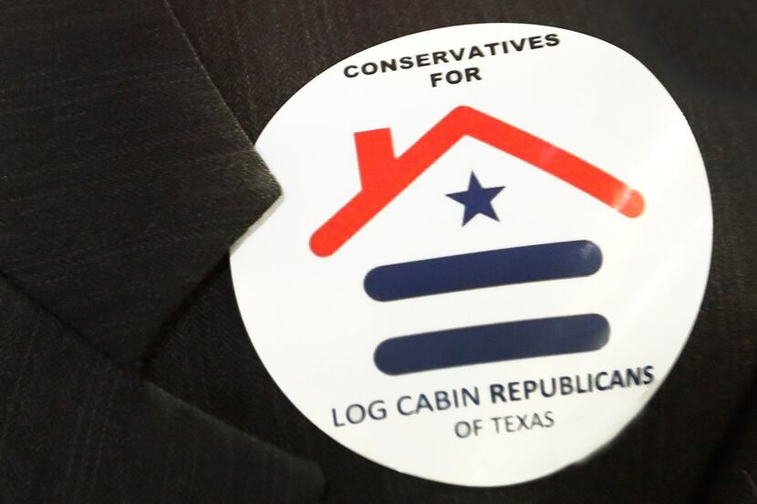 A delegate wears a sticker representing the Log Cabin Republicans, as seen during the 2018...