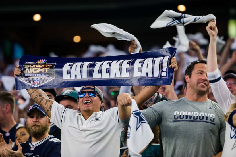Dallas Cowboys fans cheer during the first quarter of their game against the Philadelphia...
