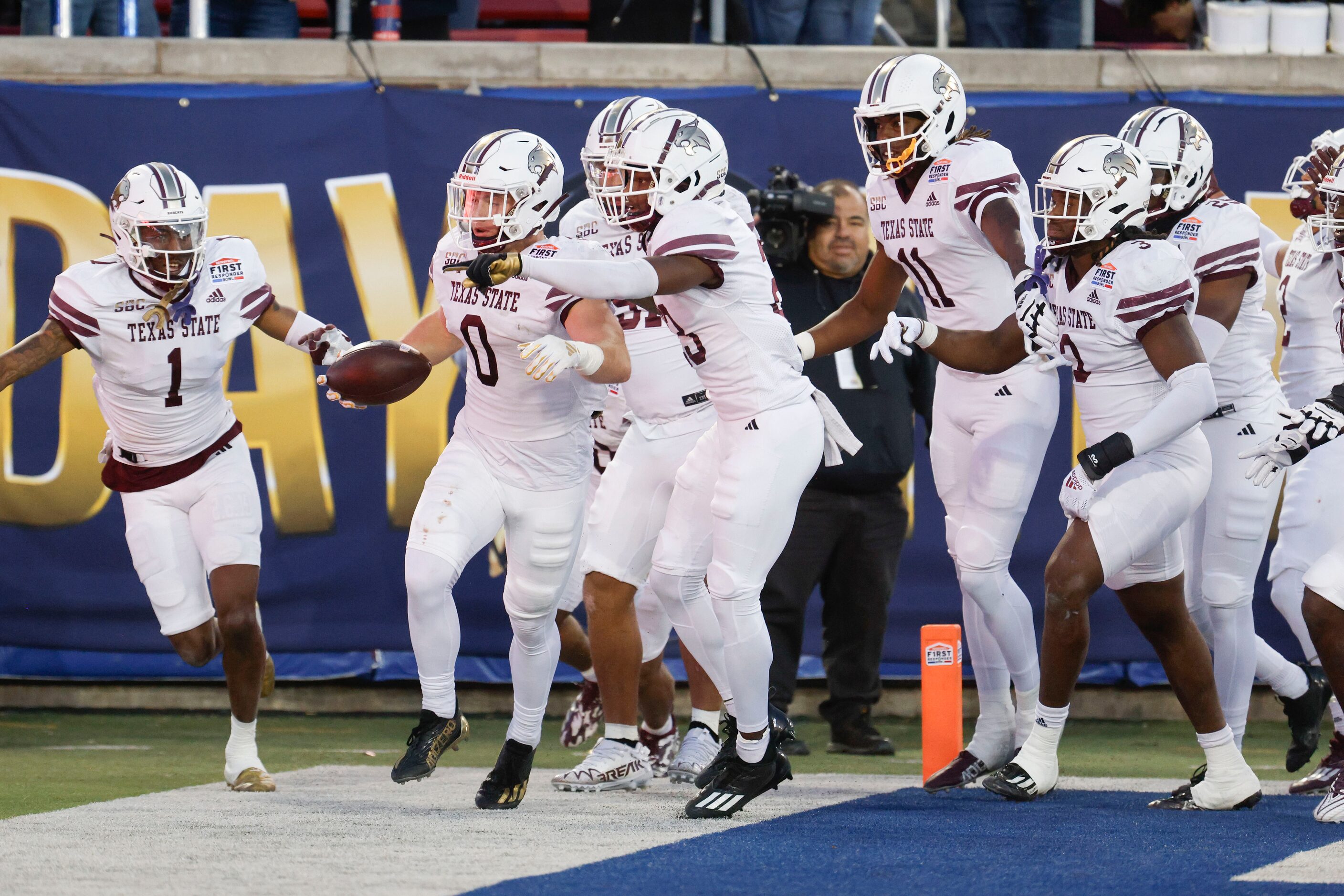 Texas State linebacker Brian Holloway (0) celebrates a pick six with his teammates during...