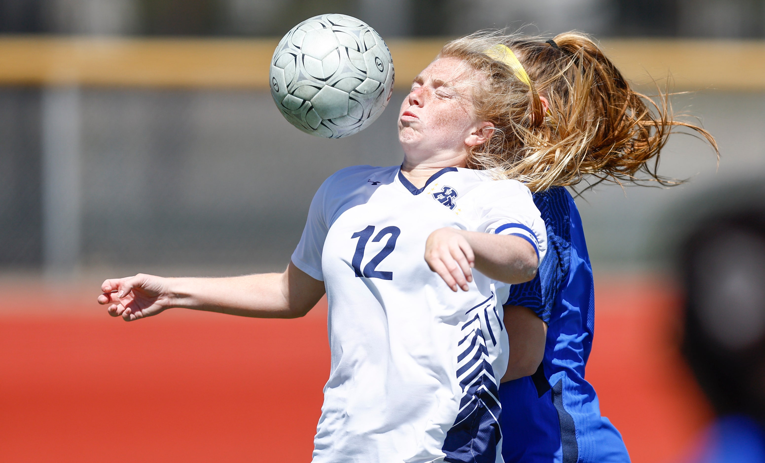 Highland Park’s Kylie Bell (12) battles Frisco’s Taylor Vance, background, for the ball...