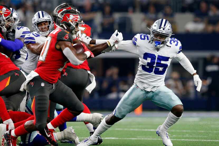 FILE - Cowboys free safety Kavon Frazier (35) chases Tampa Bay Buccaneers wide receiver...
