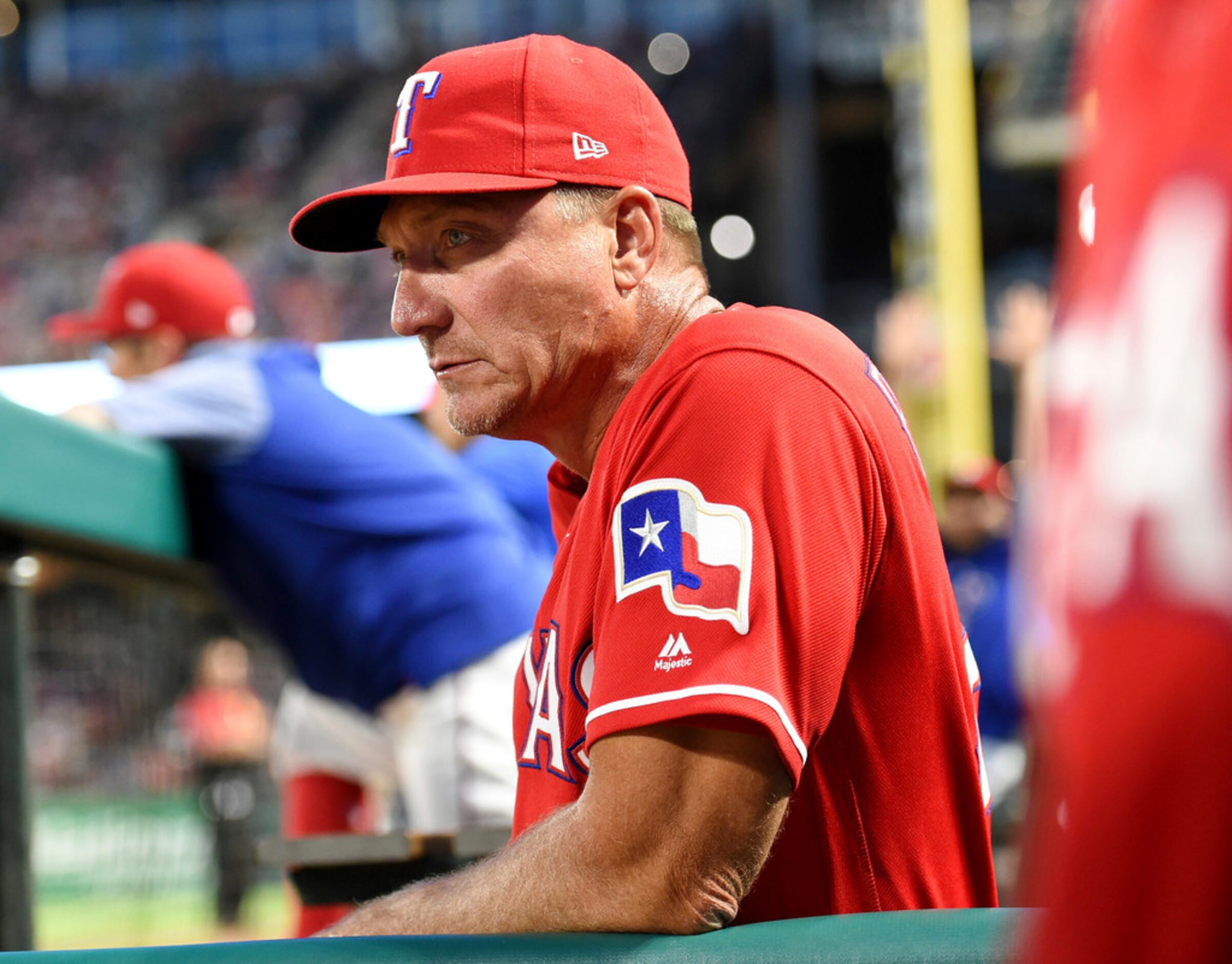 Texas Rangers manager Jeff Banister watches from the dugout during the fifth inning of the...