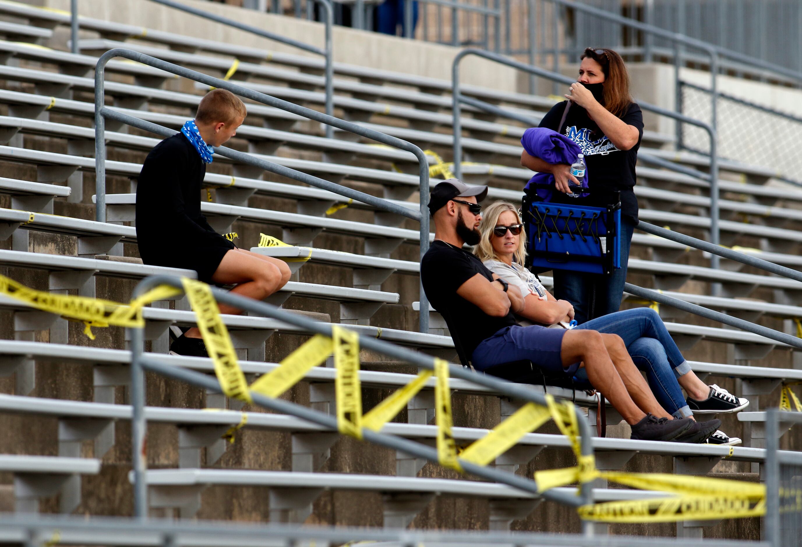 A group of Lindale fans await the opening kickoff of their scheduled  football game against...