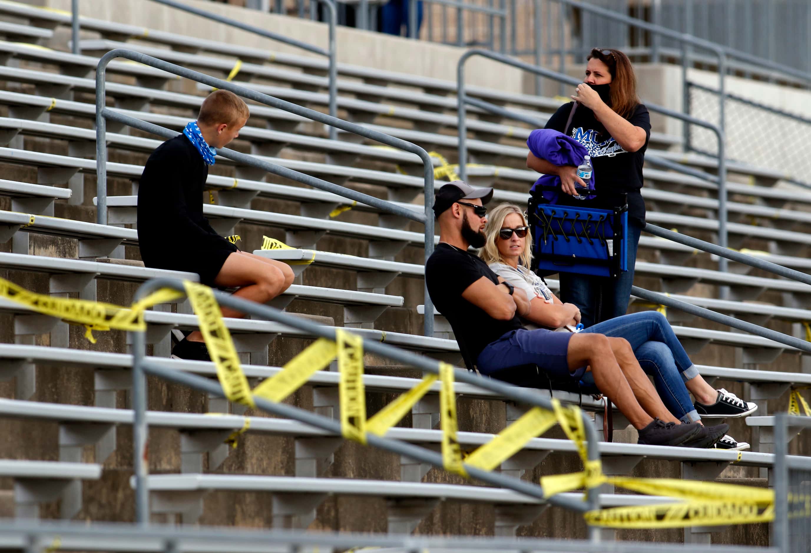 A group of Lindale fans await the opening kickoff of their scheduled  football game against...