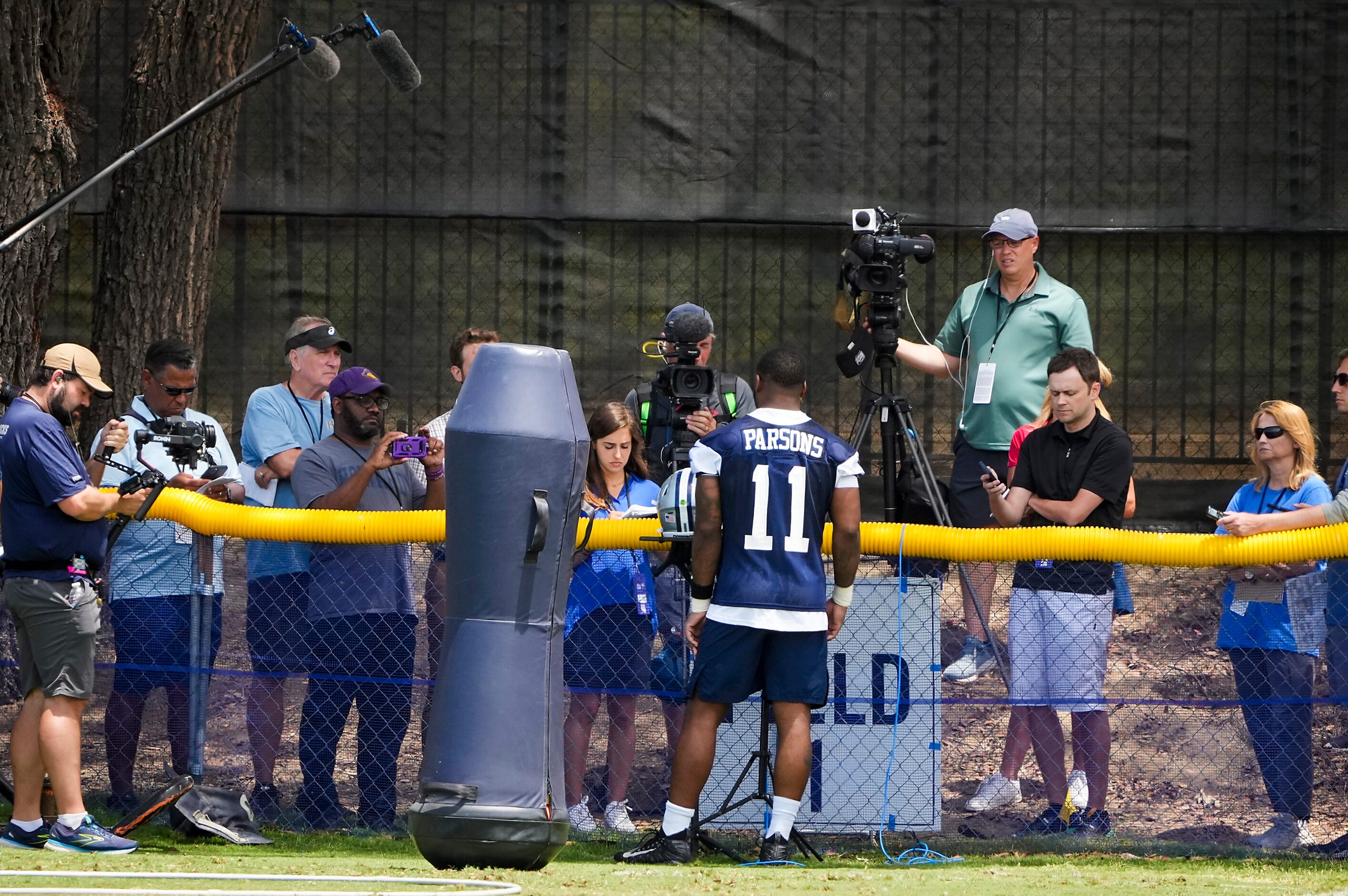 Dallas Cowboys linebacker Micah Parsons addresses reporters following the first practice of...