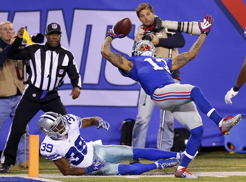 Despite the pass interference by Dallas Cowboys cornerback Brandon Carr (39), New York...