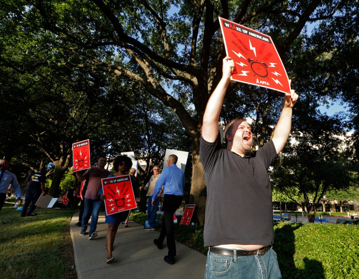 Josh Fitzgerald pickets with flight attendants outside American Airlines headquarters in...