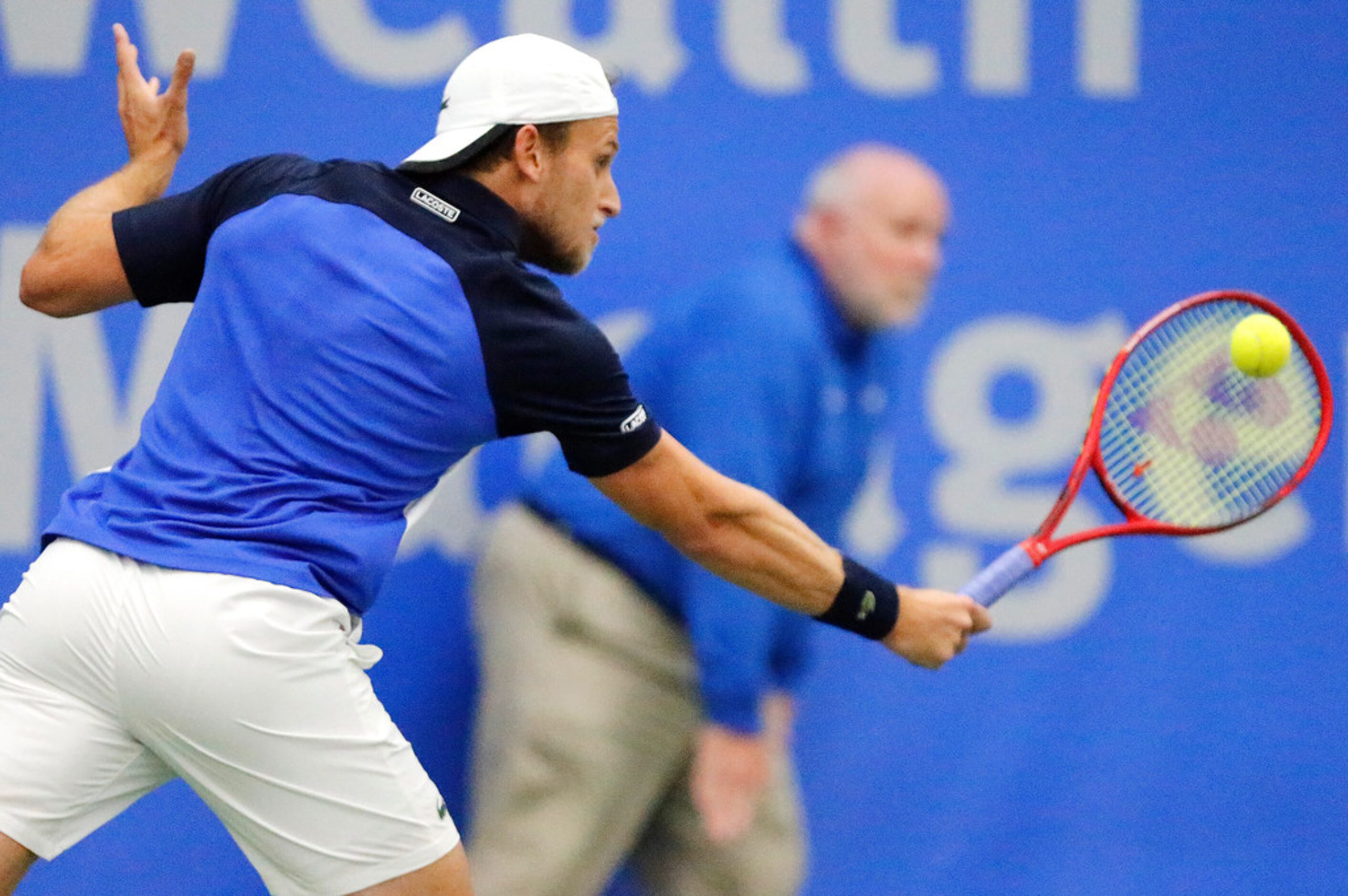 Denis Kudla makes a backhand shot as he plays Frances Tiafoe  in a match during the RBC...