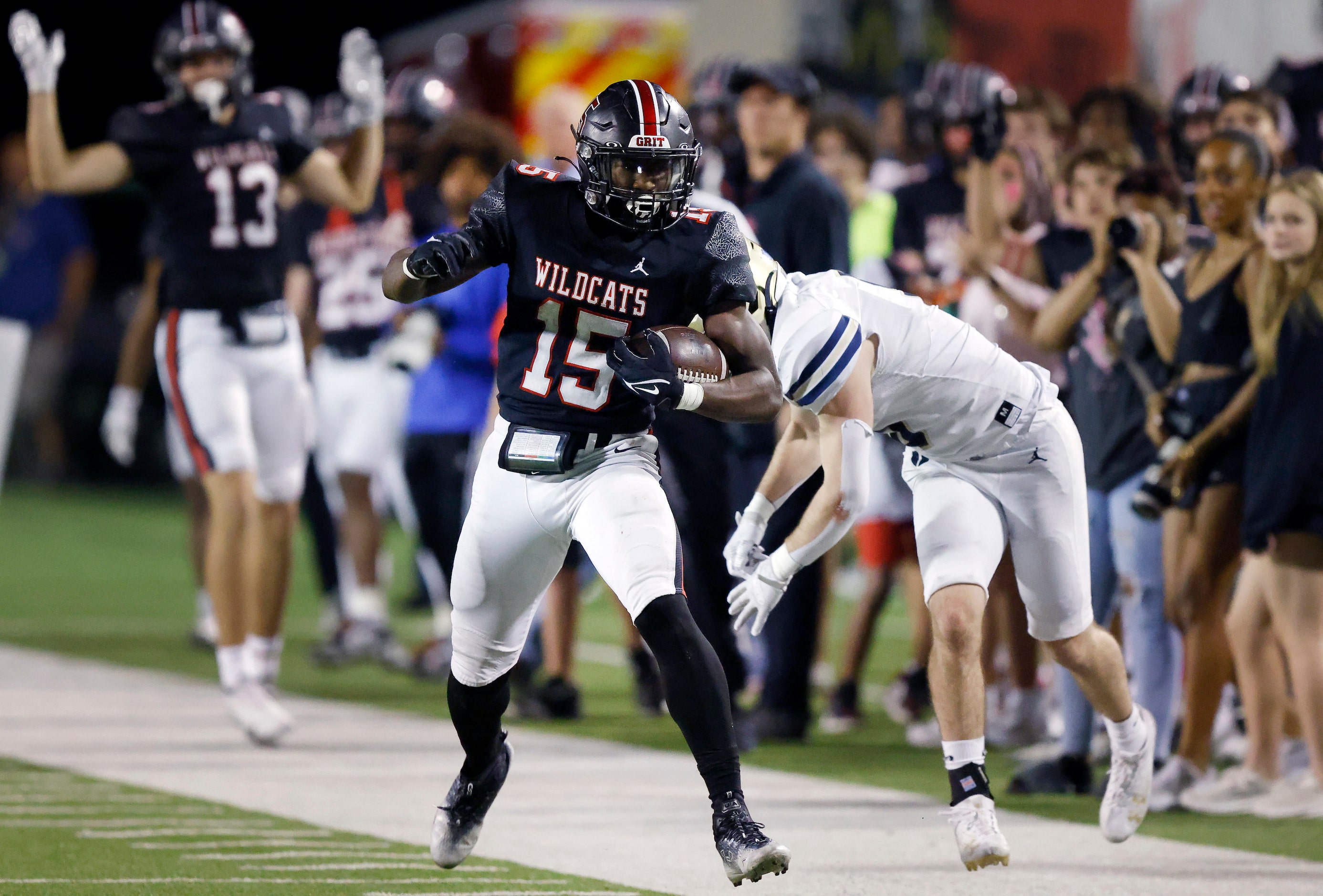 Lake Highlands High running back Christian Rhodes (15) shakes Jesuit High defensive back...