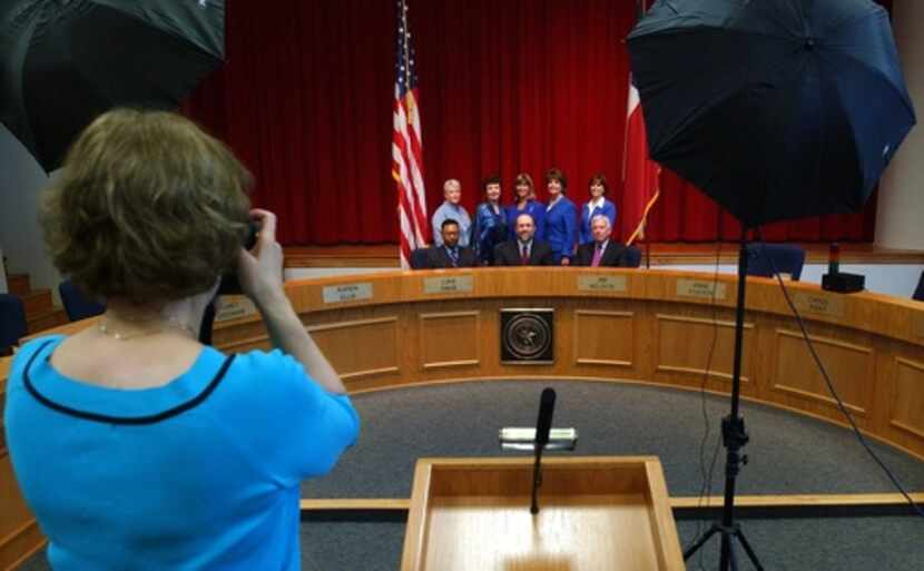 David Tyson Jr. (left in front row) posed with the Richardson school board in 2005. Thirteen...