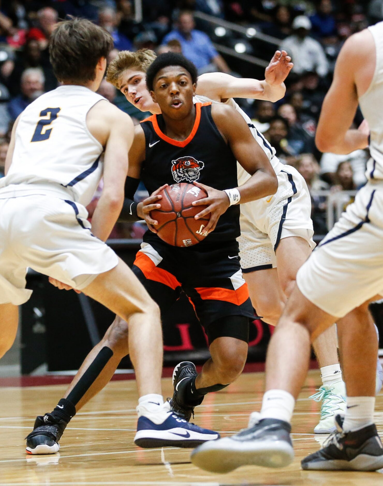 Lancaster's Wade Taylor IV (4) looks for a lane during the first half of a boys basketball...