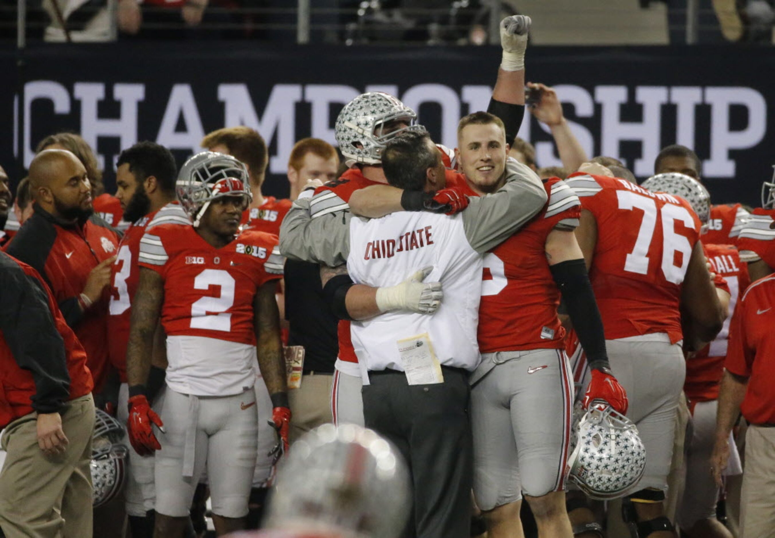 Tight end Jeff Heuerman (5) hugs head coach Urban Meyer as time runs out in the Buckeyes...