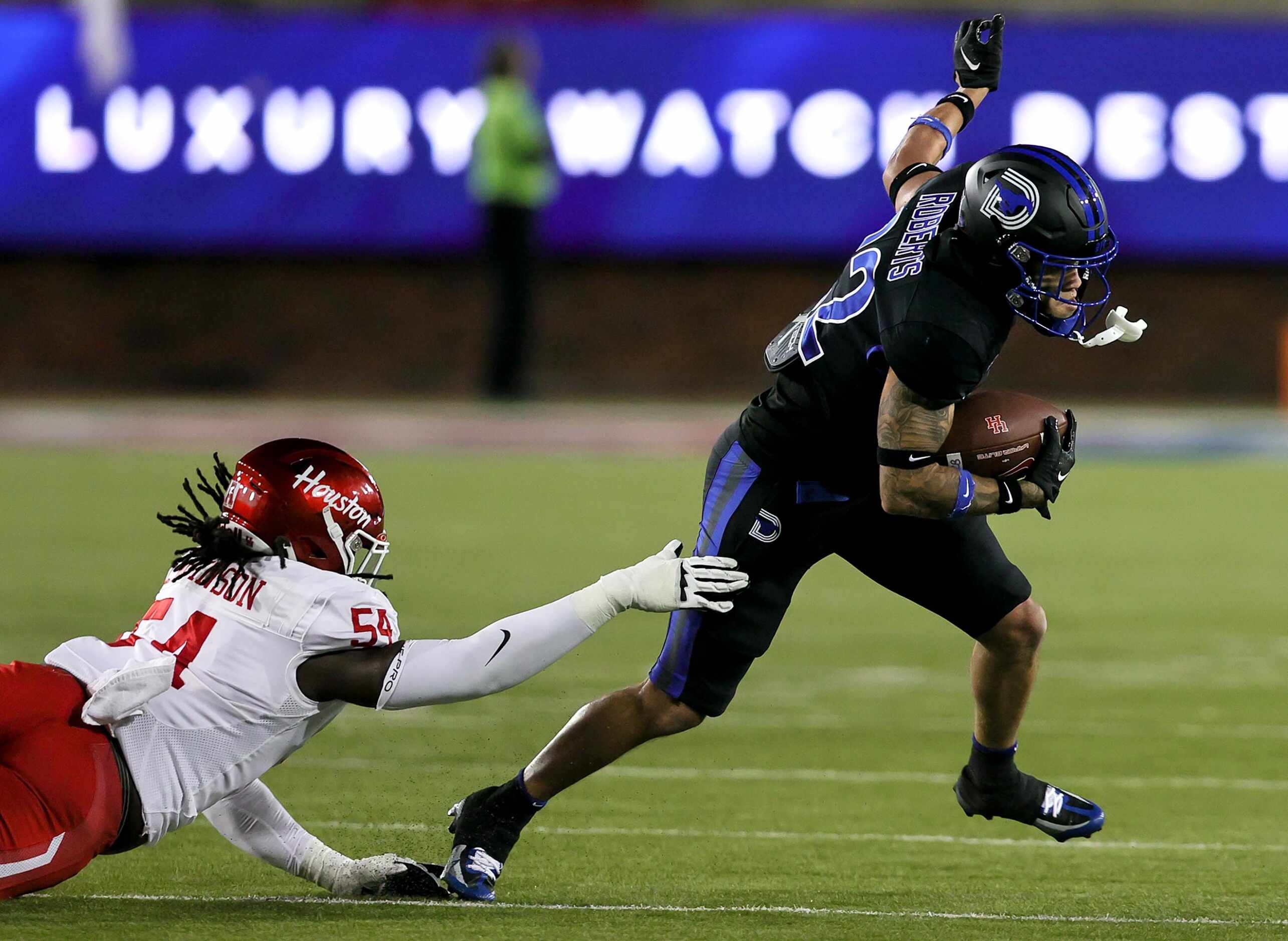 SMU safety Nick Roberts (22) comes up with an interception against Houston during the first...