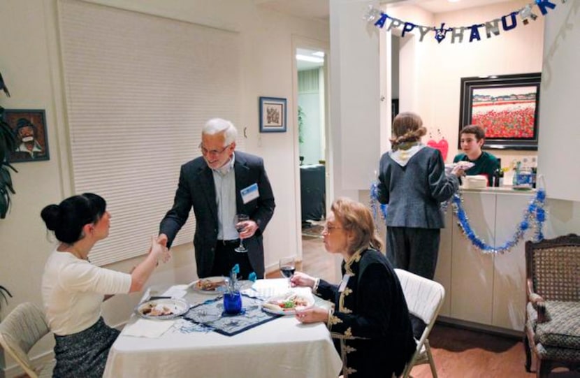 
Casie Squires (from left), Art Weinberg and Deanne Termini join at a table during the...