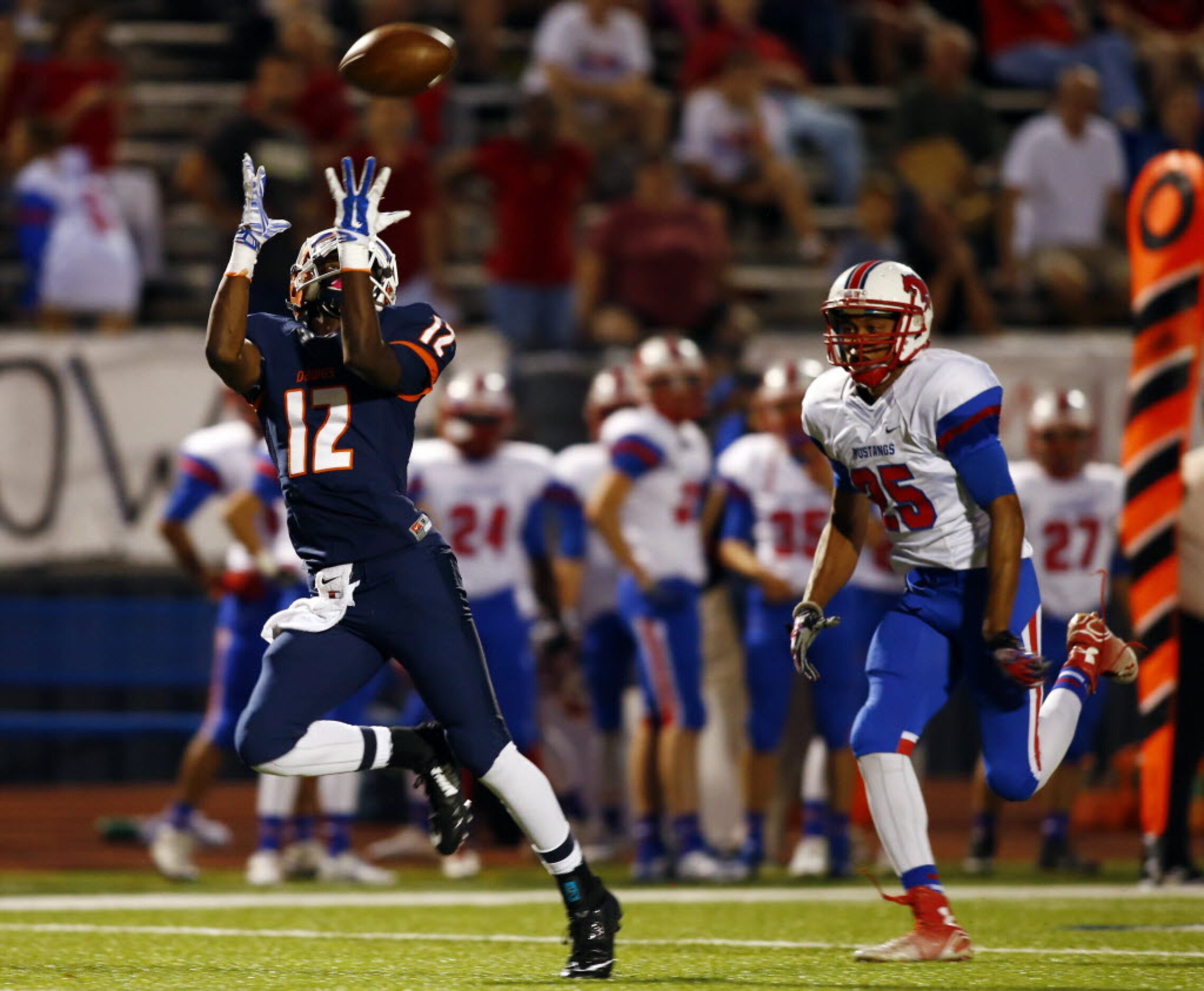 TXHSFB McKinney North wide receiver Miguel Hudson (12) reaches for the ball as Richardson...