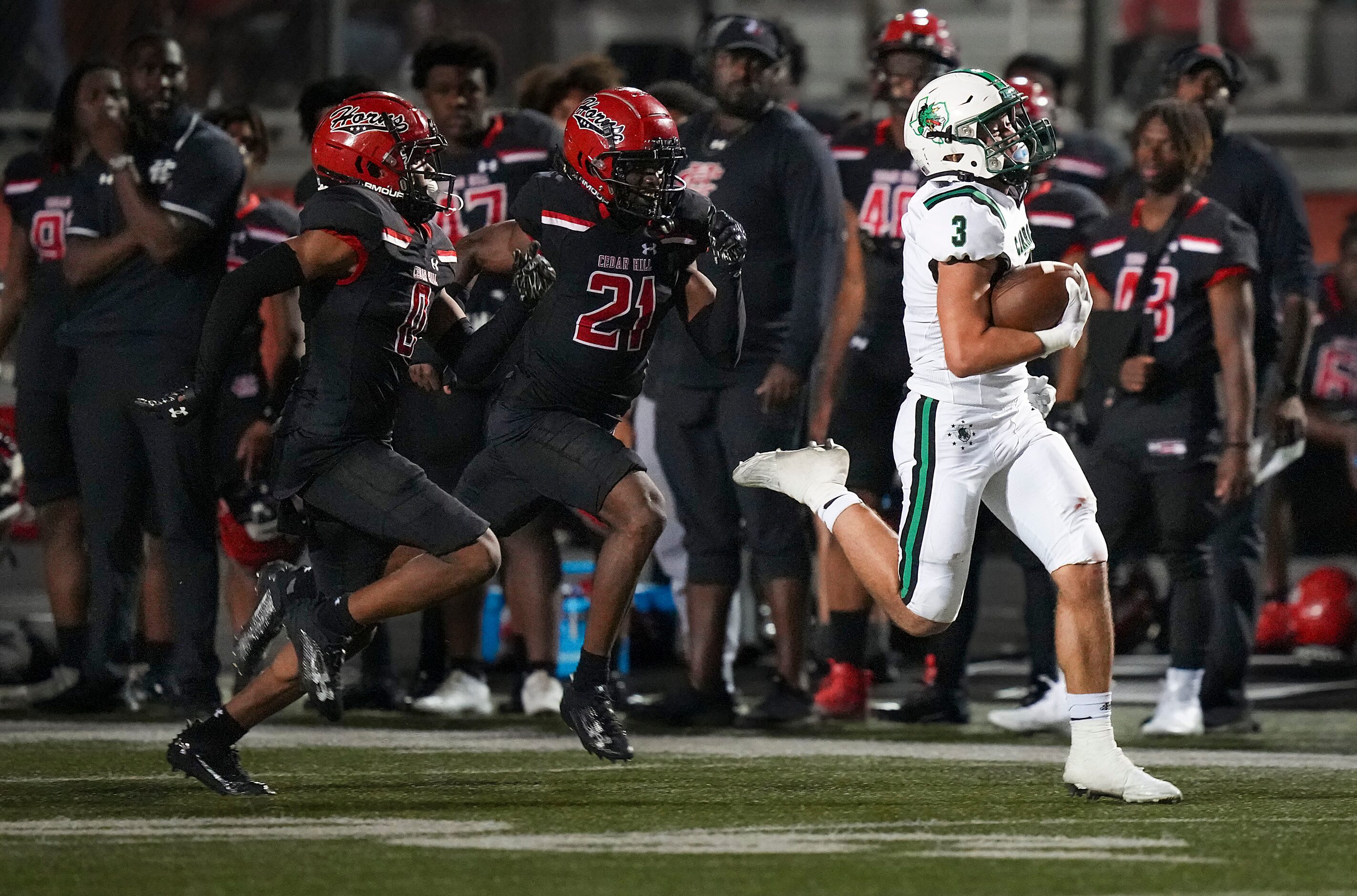 Southlake Carroll running back Davis Penn (3) races down the sidelines past Cedar Hill’s ...