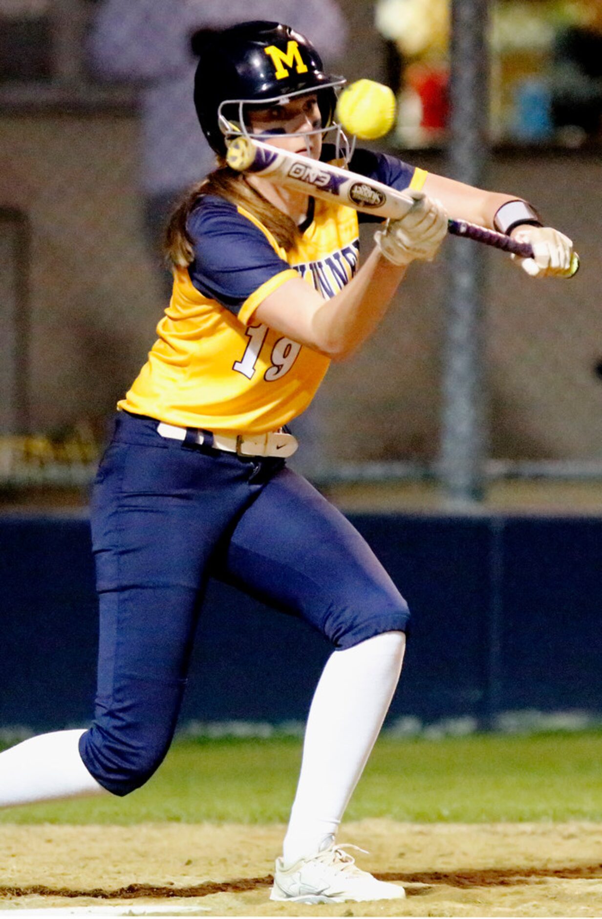 McKinney High School first baseman A.J. Poell (19) attempts a bunt in the third inning as...