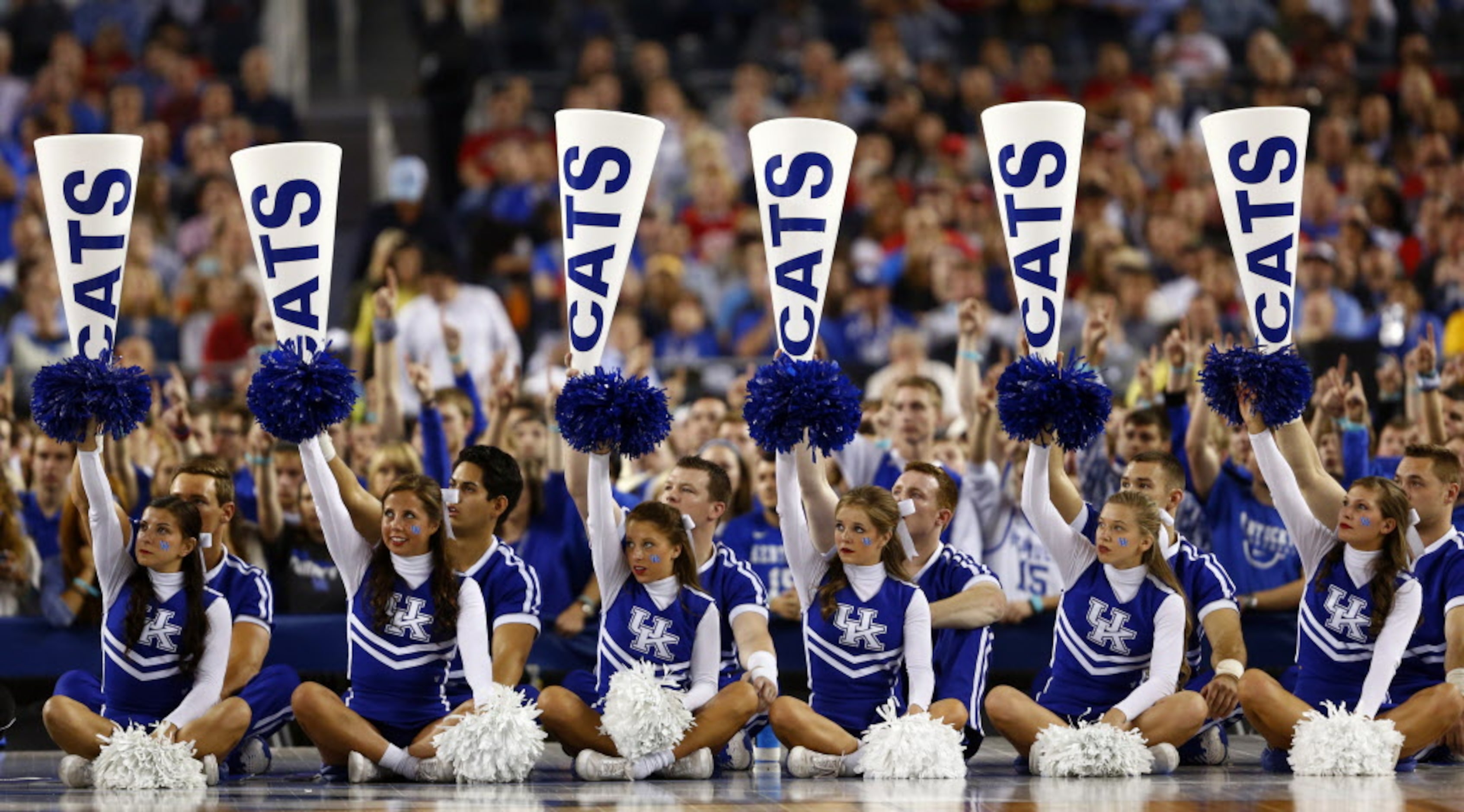 Kentucky Wildcats cheerleaders wait as Kentucky Wildcats  shoot a free throw during the...