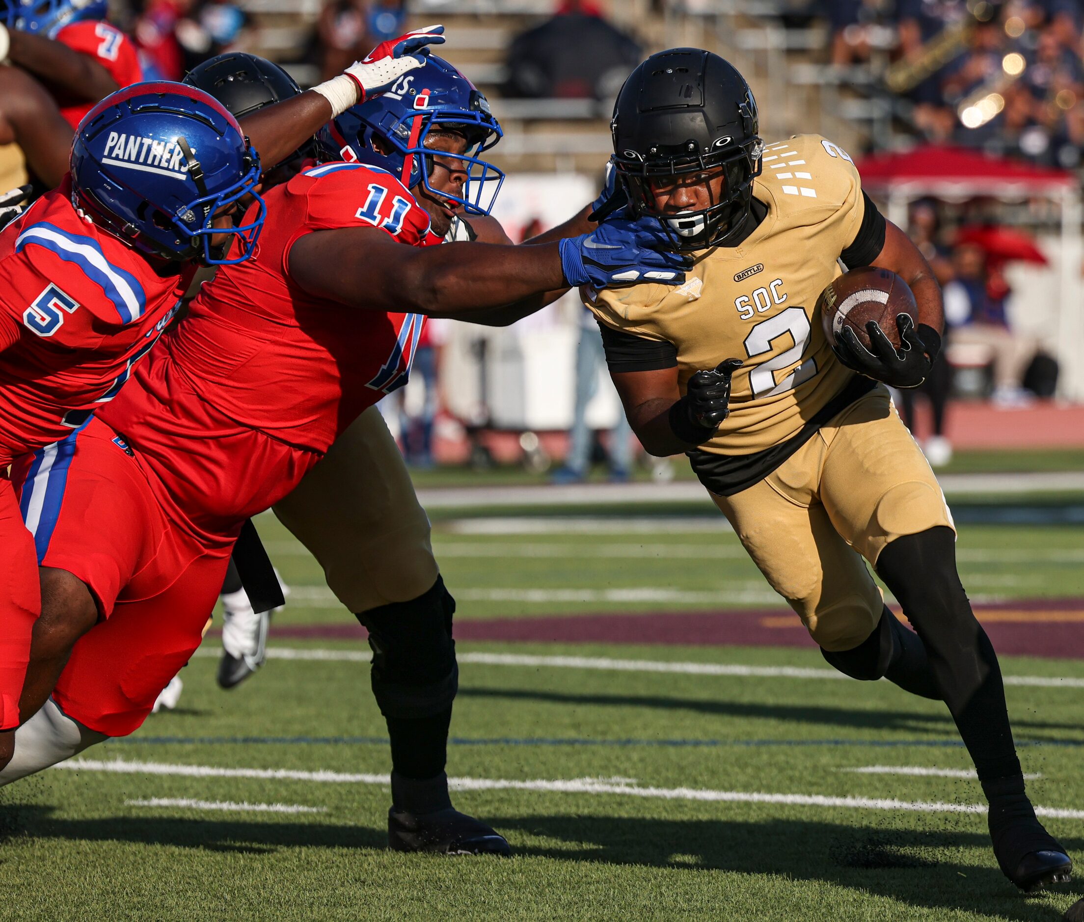 Duncanville High School Malachi Medlock (5) and Quincy Wright (11) reach for South Oak Cliff...