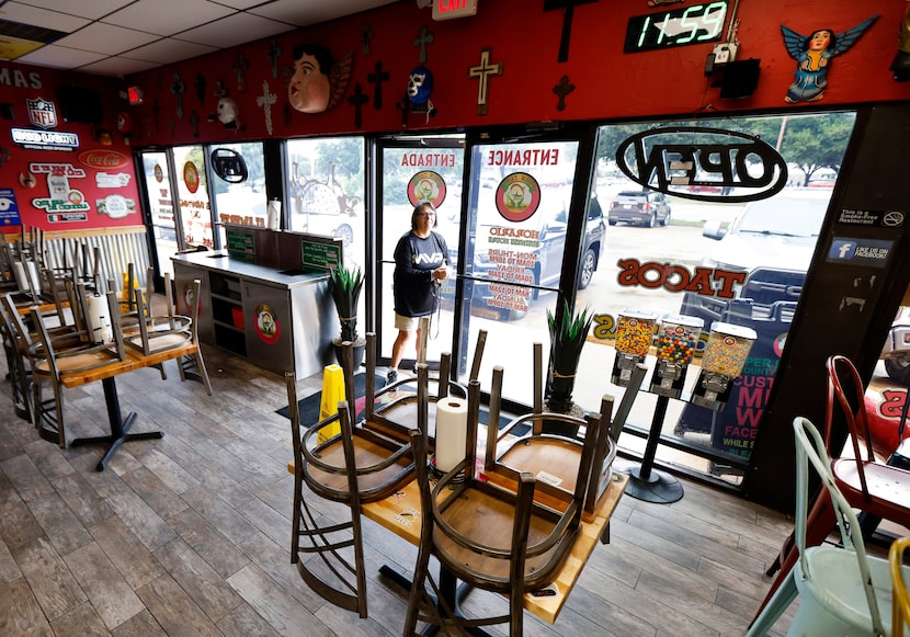 Grand Prairie resident Blanca Garcia arrived to turned up chairs and an empty restaurant at...