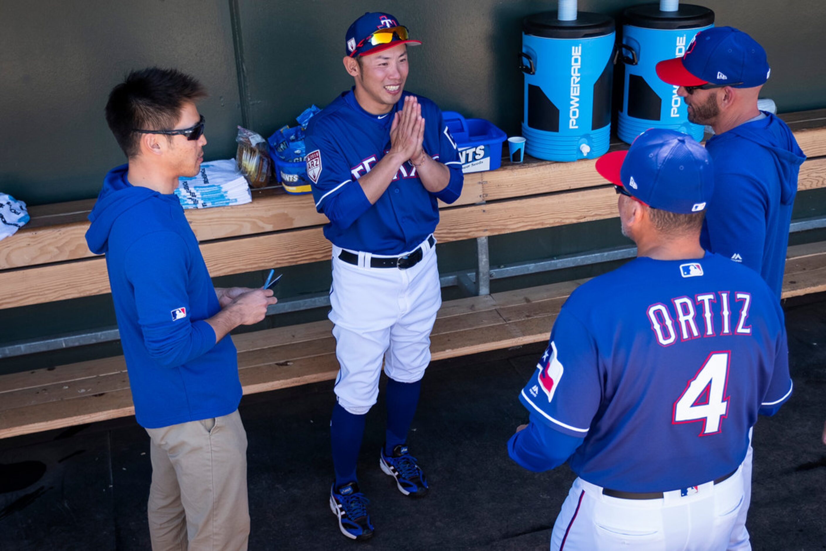 Hokkaido Nippon Ham Fighters  instructor-in-training Kenji Yano talks with Texas Rangers...