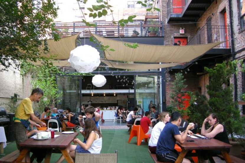 
At the New York Loft Hostel, residents and visitors mingle on the patio, also the site of...