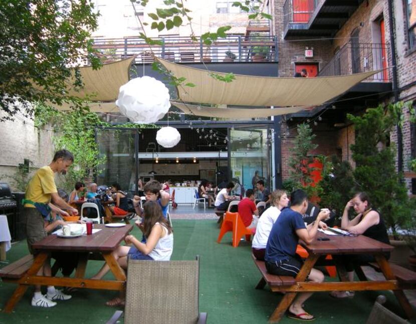 
At the New York Loft Hostel, residents and visitors mingle on the patio, also the site of...