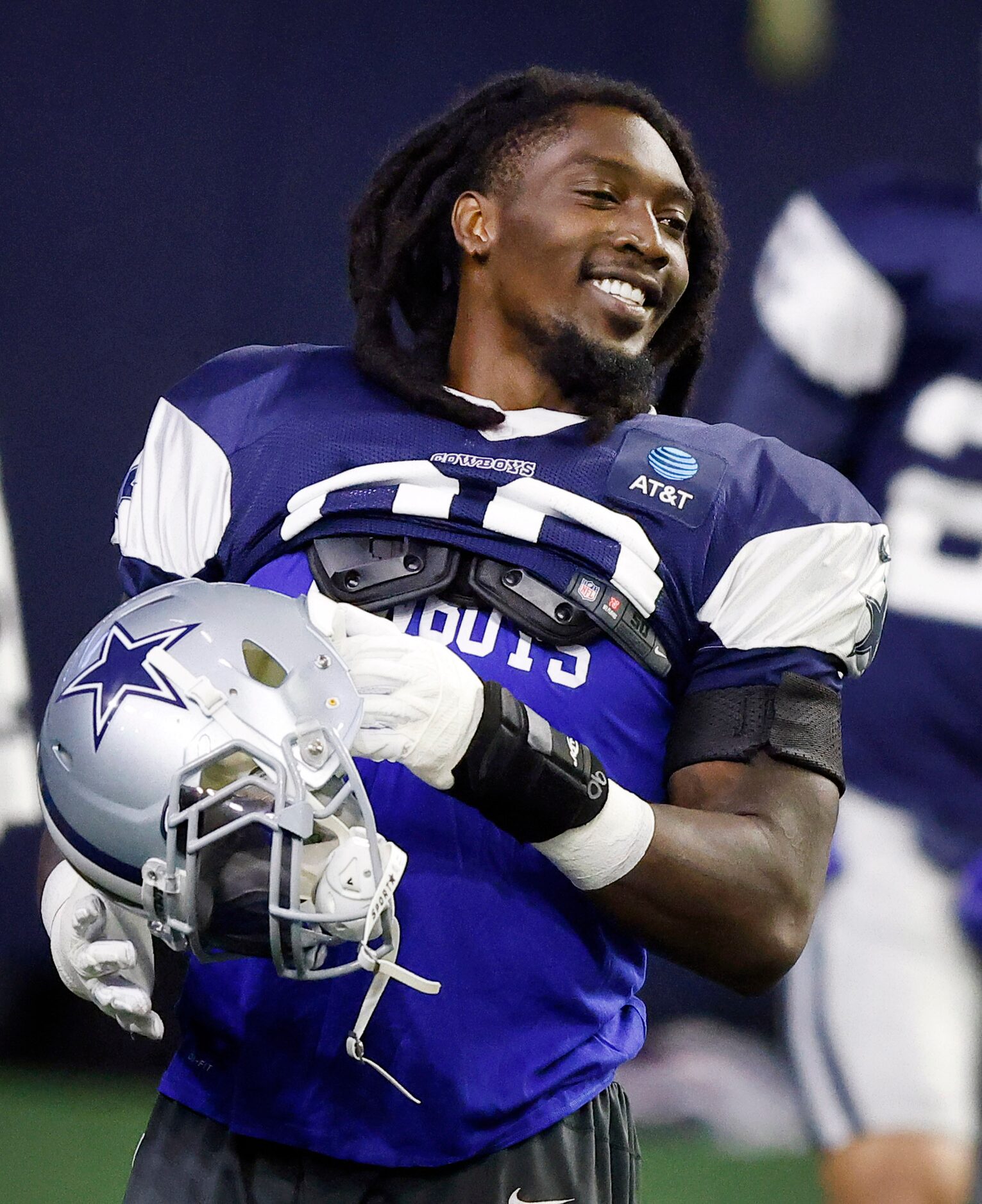 Dallas Cowboys defensive end DeMarcus Lawrence (90) dances to the music played during...