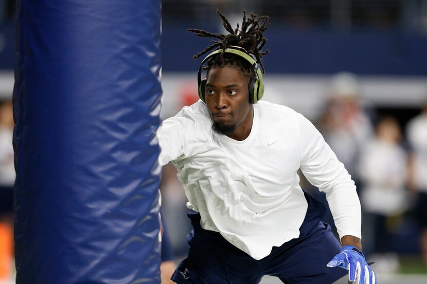 Dallas Cowboys defensive end Demarcus Lawrence (90) works out before a game against the...