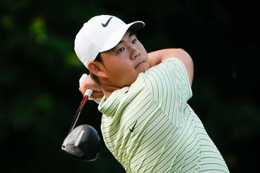 Tom Kim hits from the 13th tee during the third round of the Travelers Championship golf...