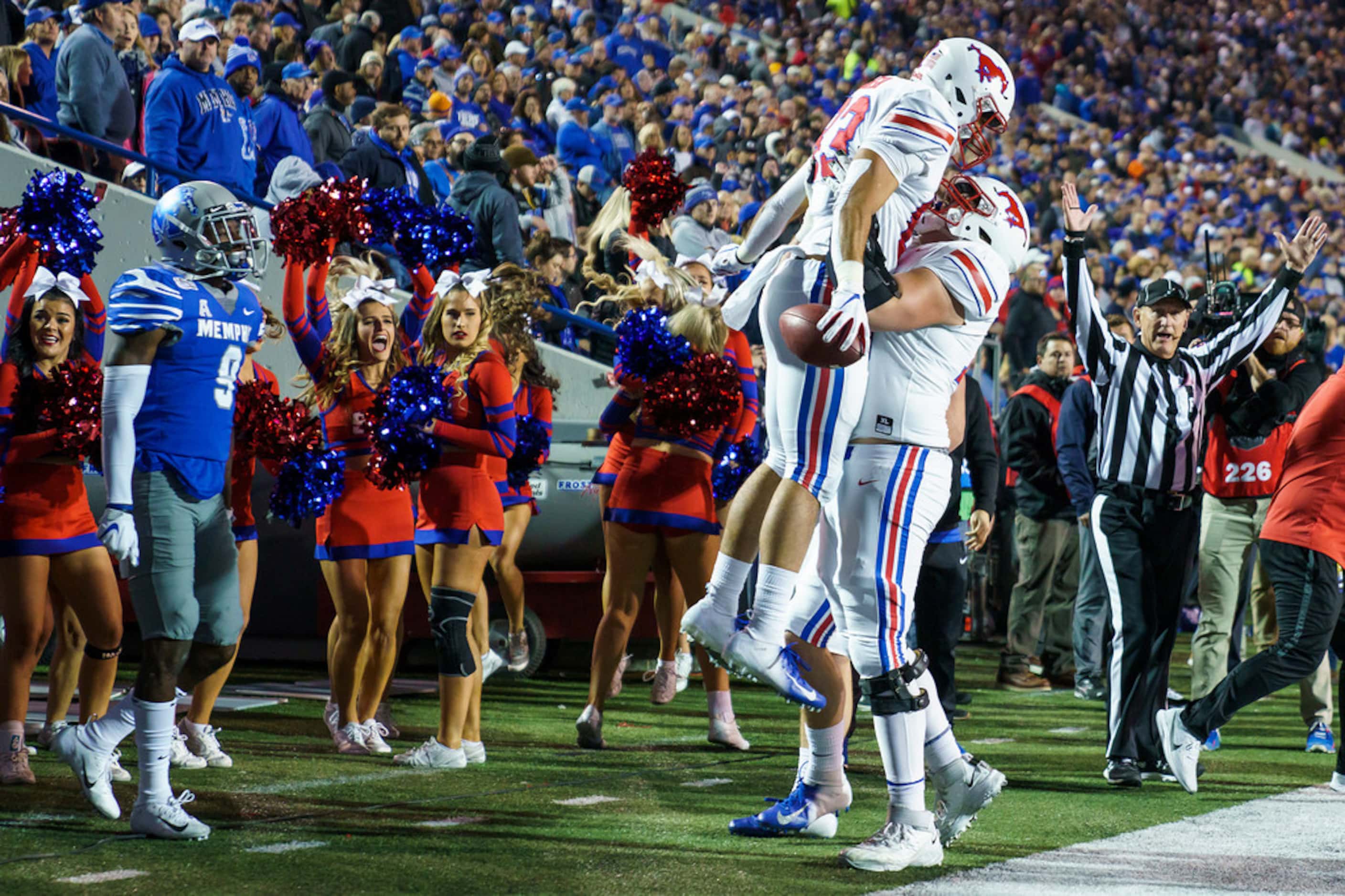 SMU tight end Kylen Granson (83) celebrates with offensive lineman Beau Morris (78) after...