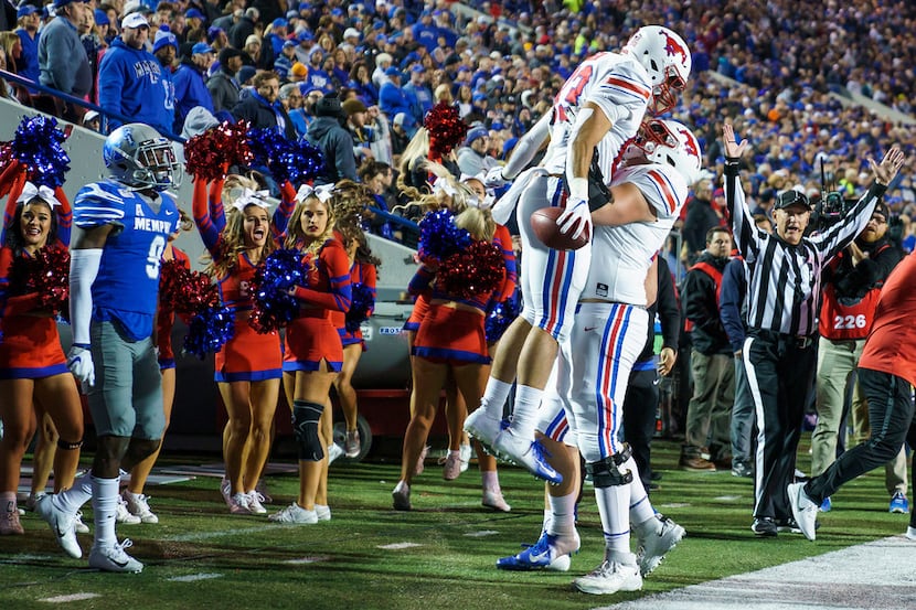 SMU tight end Kylen Granson (83) celebrates with offensive lineman Beau Morris (78) after...