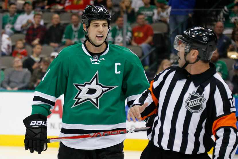 Dallas Stars left wing Jamie Benn (14) talks with an official during the Chicago Blackhawks...