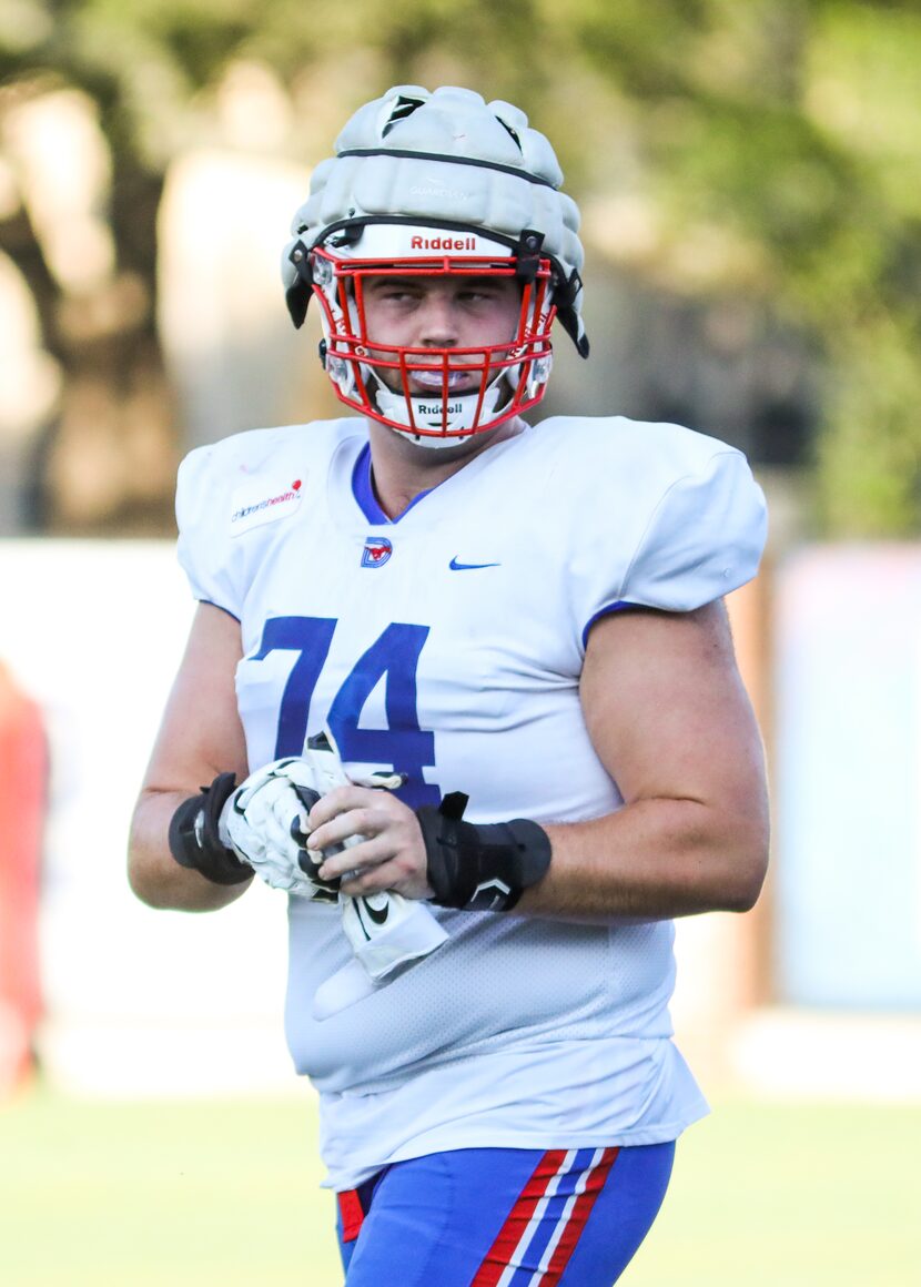 Southern Methodist University offensive line Owen Condon runs through a drill during...