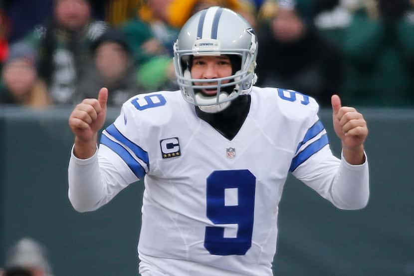 Dallas Cowboys quarterback Tony Romo (9) signals thumbs up during the Dallas Cowboys vs. the...