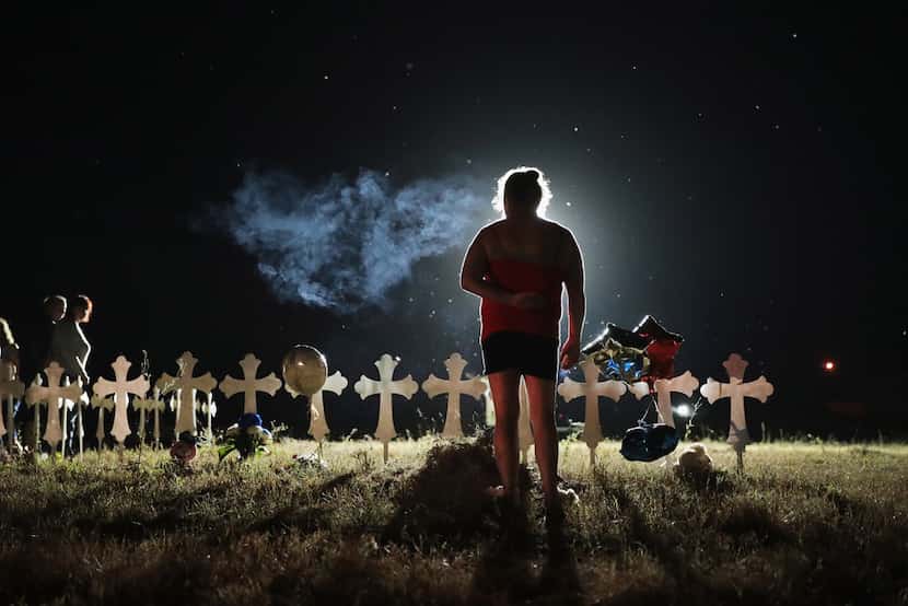 Twenty-six crosses stood in a field on the edge of Sutherland Springs to honor the victims...