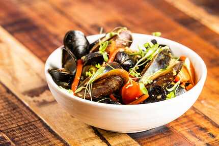 The spicy Thai-style mussels at District look like they'd pair nicely with a glass of cold...