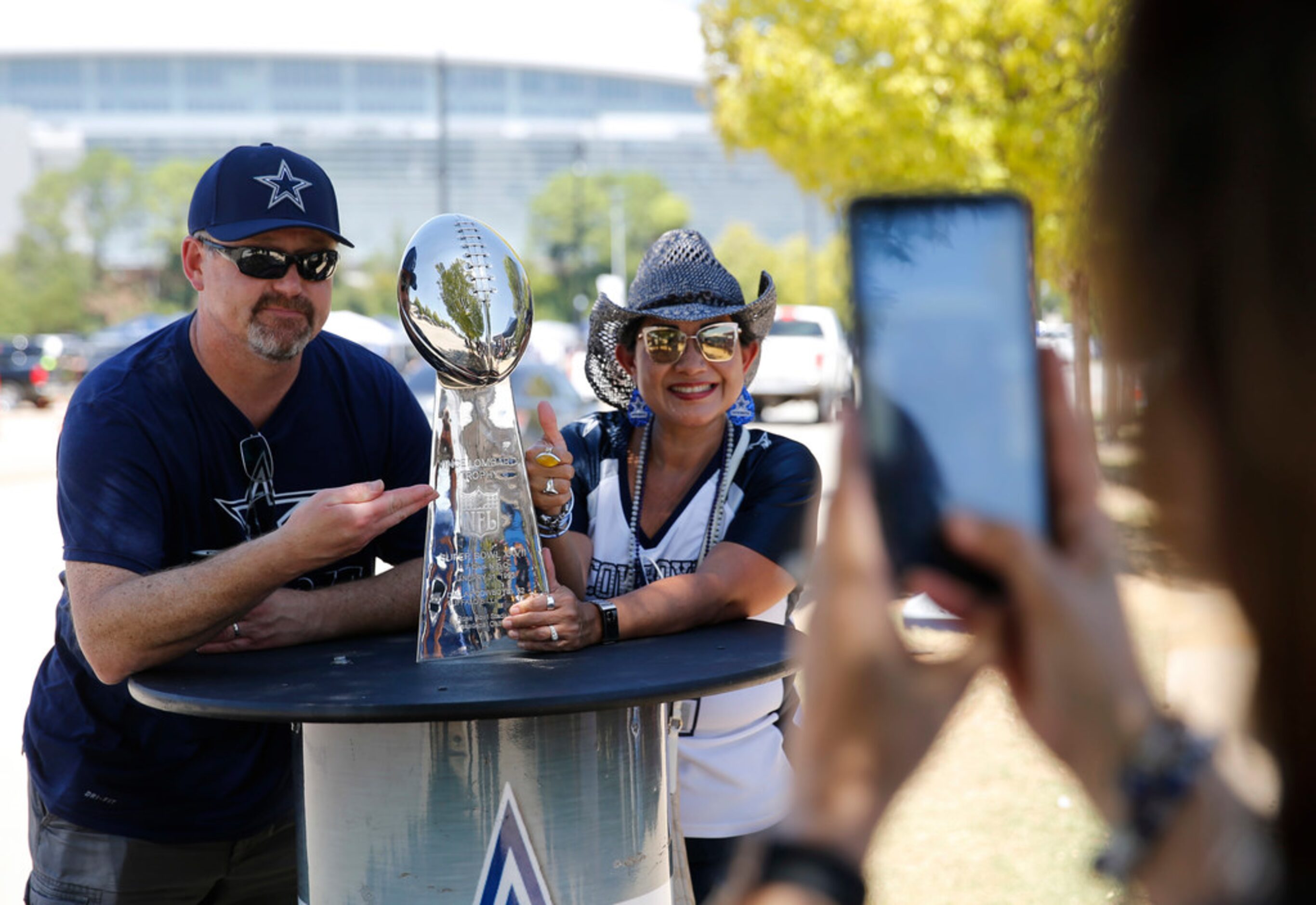 R.P. Nilsson and Sheila Nilsson of Arlington pose for a photo as Jayne Mendoza of Cedar Hill...