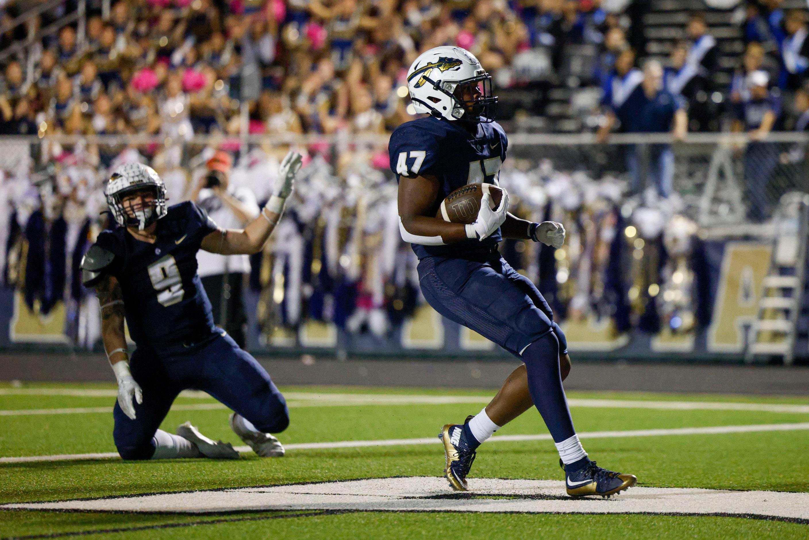 Keller running back Jayden Hart (47) runs into the end zone for a touchdown as tight end...