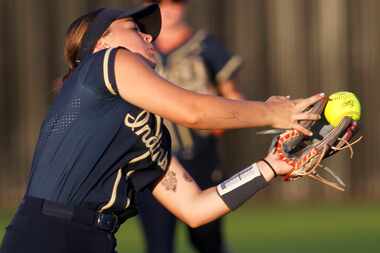 Keller Indians third baseman Landry Beaman (6) pulls in a high fly ball during the bottom of...