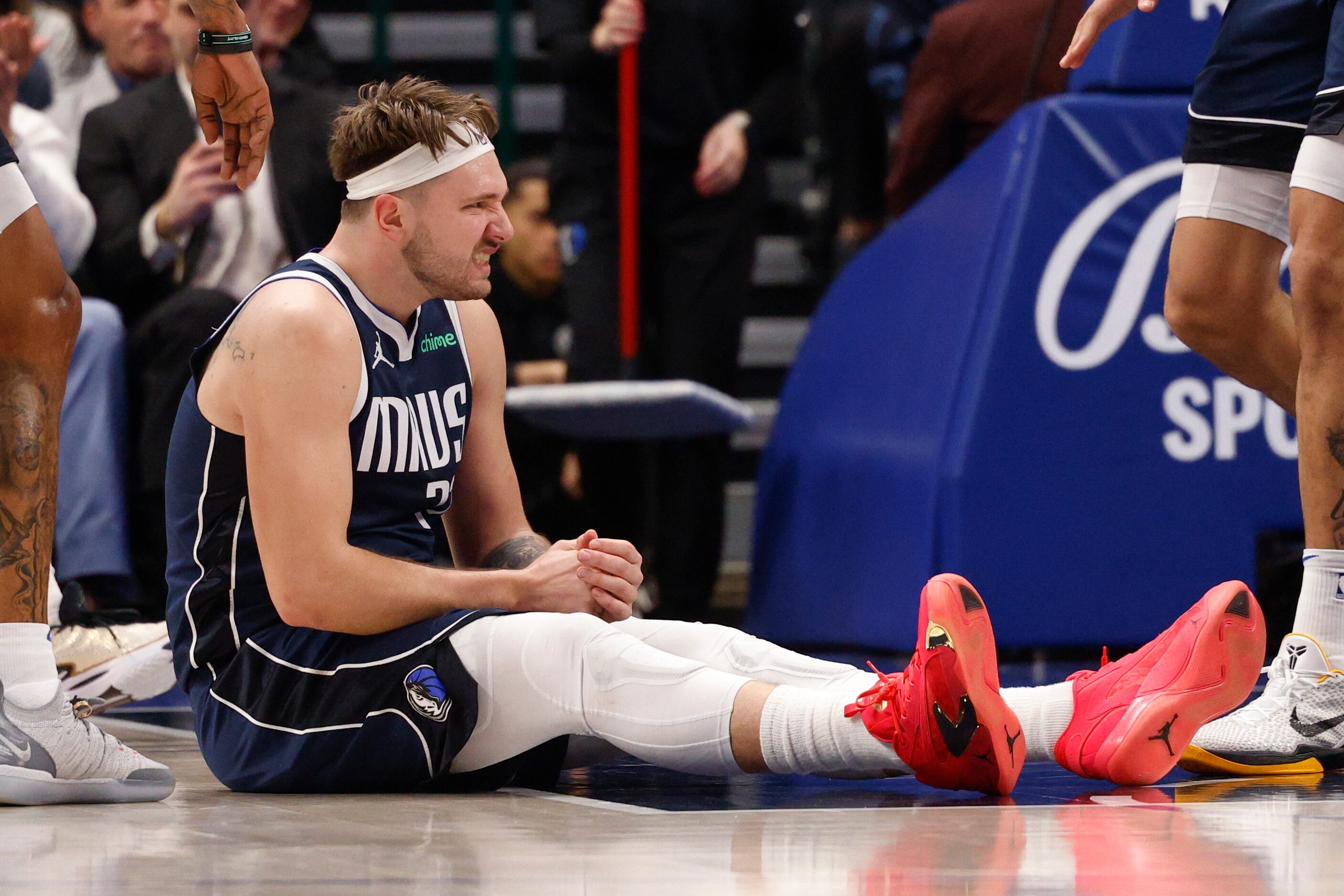 Dallas Mavericks guard Luka Doncic (77) grimaces after being fouled during the first half of...