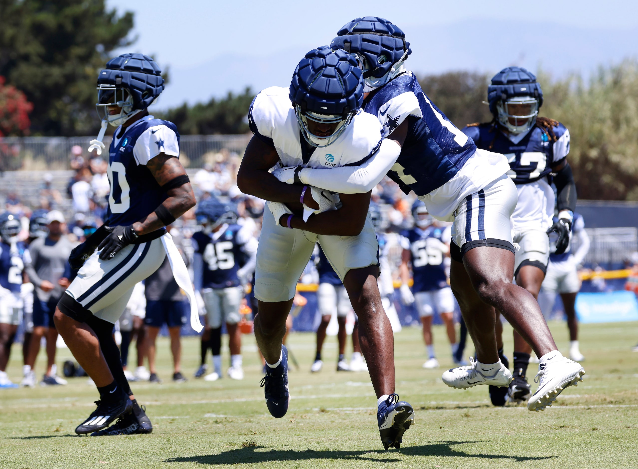 Dallas Cowboys tight end John Stephens (81,center) secures a touchdown pass as he’s covered...