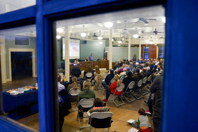 People gather to listen to city officials for a town hall about the April 8 total solar...