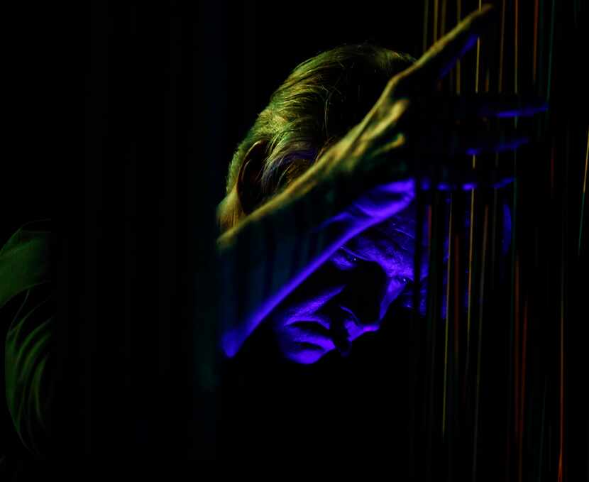 Guitarist Nels Cline interacts with a sounding sculpture by Harry Bertoia during a concert...