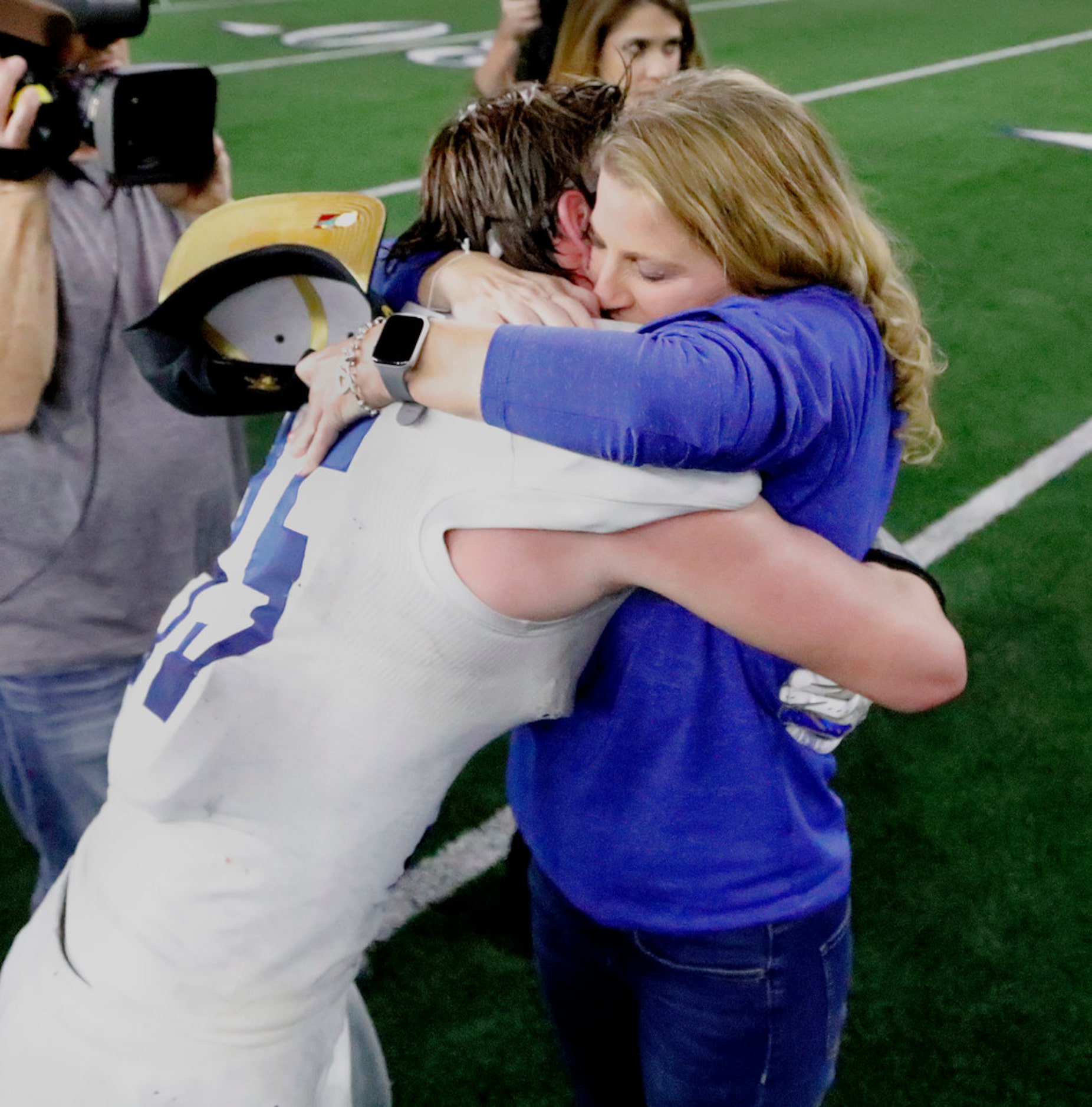 Gunter High School running back Peyton Lowe (35) is congratulated by his mother Brandi Lowe...